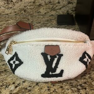 Waist and cross body faux fur bag .